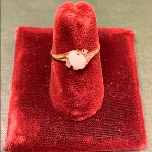 10 k Opal ring with two small diamond chips.